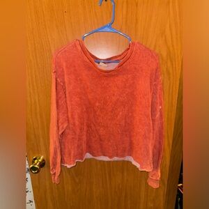Large cropped crew neck. Burnt orange color.